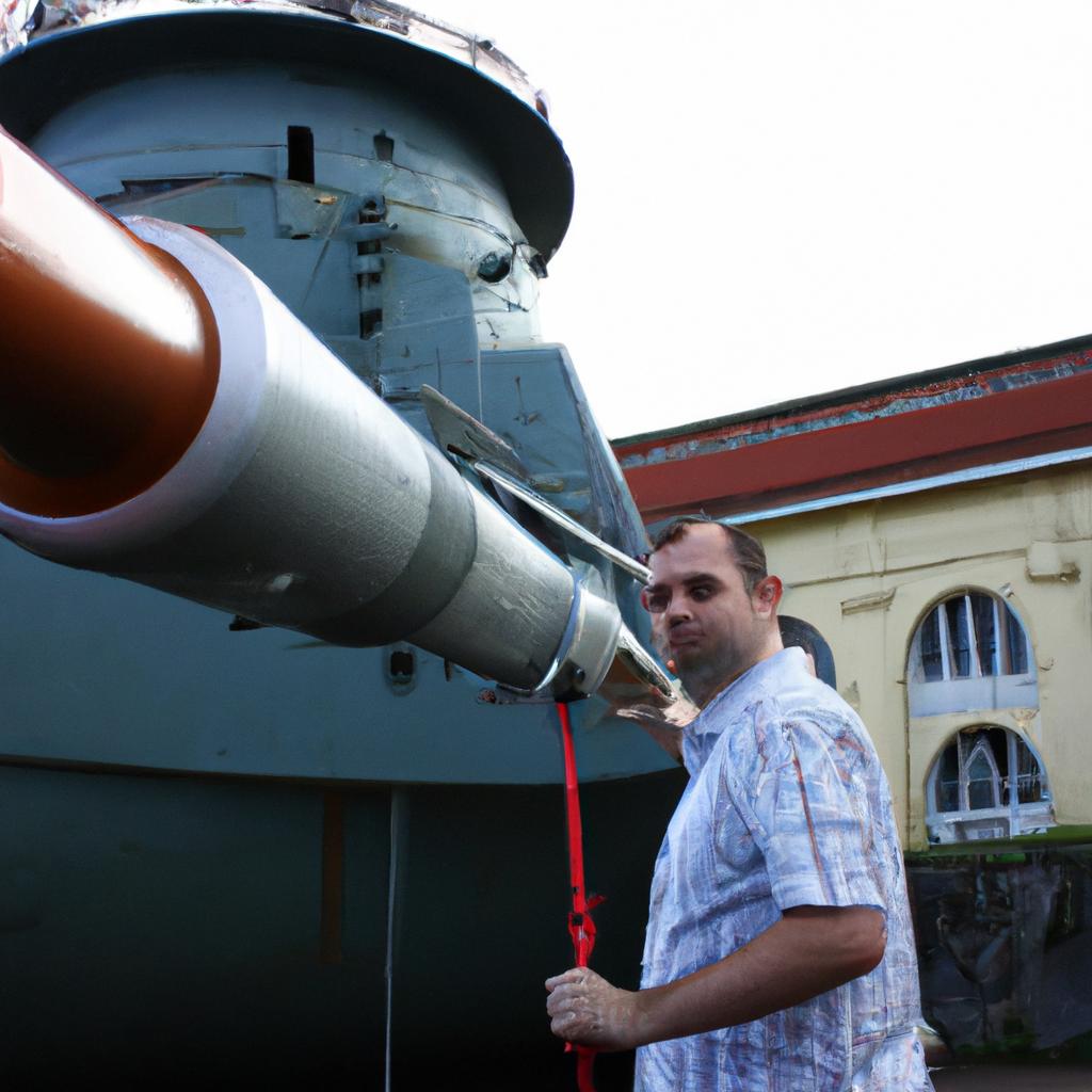 Person unveiling museum ship armament